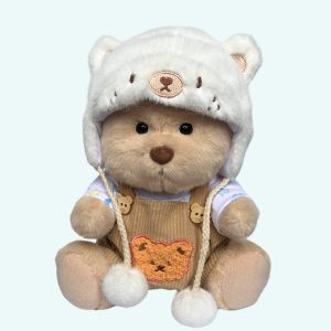 Nino – L’orso di peluche articolato fatto a mano con maglione lavorato a maglia e salopette marrone